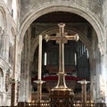 golden cross inside St. Bartholomews church in London Royalty Free Stock Photo