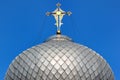 Golden cross on metal dome roof of an orthodox church, Ukraine Royalty Free Stock Photo