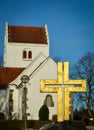 Golden cross at village church Royalty Free Stock Photo