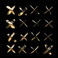Golden crosses made of brush stroke isolated on black background. Vector design elements set.