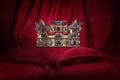 Golden crown on red velvet background Royal symbol  coronation Royalty Free Stock Photo