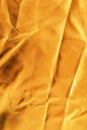 Golden crumpled fabric texture