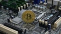 Golden Cryptocurrency Coin on Computer Motherboard Close-Up, Technology Concept Royalty Free Stock Photo
