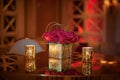 Golden cube vase with red roses arrangement on the table with reflection Royalty Free Stock Photo