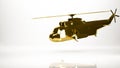 golden 3d rendering of a helicopter inside a studio