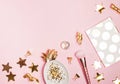 Golden decor and feminine accessories on the pink background,