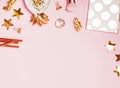 Golden decor and feminine accessories on the pink background Royalty Free Stock Photo