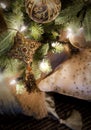 Golden decorations hanging on Christmas tree