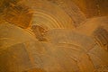 Golden decorative relief plaster on wall.