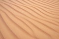 Golden  desert sand texture as background. Royalty Free Stock Photo