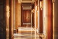 Golden design elements contribute to corridor sense of spaciousness. Hallway serves as gallery of modern art in hotel