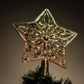 Golden Star on Top of Christmas Tree Royalty Free Stock Photo