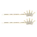 Golden diamond hair clips with small crowns for hair Royalty Free Stock Photo