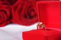 Golden diamond ring in box and red rose Royalty Free Stock Photo