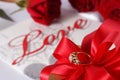Golden diamond ring with gift box and red rose Royalty Free Stock Photo