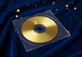 Golden disc presentation on plush blue backdrop with celestial shimmer Royalty Free Stock Photo