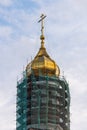 Golden dome with a cross against the sky. Orthodox cross in the blue sky. Christianity. Religion. Orthodox Christianity. Jesus. Royalty Free Stock Photo