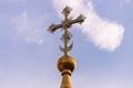 Golden dome with a cross against the sky. Orthodox cross in the blue sky. Christianity. Religion. Orthodox Christianity. Jesus. Royalty Free Stock Photo