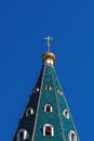 Golden dome with a cross on the green roof of the Russian Orthodox Church Royalty Free Stock Photo