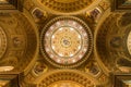 The golden dome and interior inside the church in Budapest