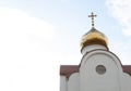 Golden dome of an orthodox temple against a cloudy sky .copyspace for text