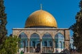 The Golden Dome of the Rock, or Qubbat al-Sakhra, and stone gate ruins in an Islamic shrine located on the Temple Mount in the Old