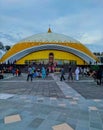 golden domed mosque and many people visit it