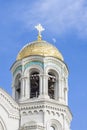 Golden domes in blue sky, St. Nicholas Cathedral bell tower in Kronstadt, half moon in blue sky and Golden dome Royalty Free Stock Photo