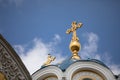 Golden domes with a cross of the Orthodox Church of Ukraine on a background of blue sky. Royalty Free Stock Photo