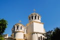 Golden domes with a crosses on the Christian Orthodox Church shine on a sunny day against blue sky. Greek and Balkan church Royalty Free Stock Photo