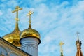 Golden domes and crosses of the Orthodox Church against the blue sky Royalty Free Stock Photo