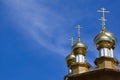 Golden domes and crosses of Russian orthodox church on blue sky background Royalty Free Stock Photo
