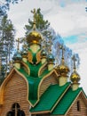 Golden domes on a wooden church Royalty Free Stock Photo