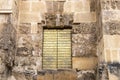 Golden door in the Mosque Cathedral in Cordoba, Spain. Exterior wall - famous landmark in Andalusia