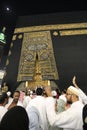 MECCA, SAUDI ARABIA - MAY 01 2018: The golden doors of the Holy Kaaba closeup, covered with Kiswah. Massive lock on the doors. Ent