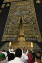 MECCA, SAUDI ARABIA - MAY 01 2018: The golden doors of the Holy Kaaba closeup, covered with Kiswah. Massive lock on the doors. Ent