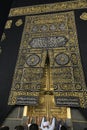 MECCA, SAUDI ARABIA - MAY 01 2018: The golden doors of the Holy Kaaba closeup, covered with Kiswah. Massive lock on the doors. Ent