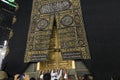 MECCA, SAUDI ARABIA - MAY 01 2018: The golden doors of the Holy Kaaba closeup, covered with Kiswah. Massive lock on the doors. Ent