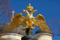 Golden double-headed eagle on a background of blue sky