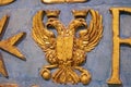 Golden double-headed eagle symbol on the wall Royalty Free Stock Photo