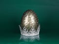 golden dragon egg and crown isolated on green Royalty Free Stock Photo