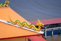 Golden dragon statue on the roof of the temple building. Royalty Free Stock Photo