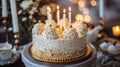 Golden Dreams: Indulgent White and Gold Cake with Candles and Gifts - Perfect for Birthdays or Weddings! Royalty Free Stock Photo