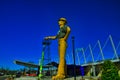 Golden driller statue side profile in Tulsa OK