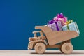 Golden dumper toy made of wood. Royalty Free Stock Photo