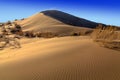 The golden dunes of the Singing Barkhan. National Nature Reserve Altyn-Emel, Kazakhstan Royalty Free Stock Photo