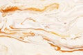 Golden dynamic and fluid raster texture. Abstract acrylic paints mixt color background.