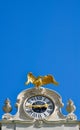 Golden eagle atop a baroque watch