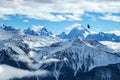 Golden eagle flying in front of swiss alps scenery. Winter mountains. Bird silhouette. Beautiful nature scenery in winter. Royalty Free Stock Photo