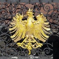 Golden eagle, heraldic animal and symbol for Frankfurt, at an old iron fence downtown at the Roemer